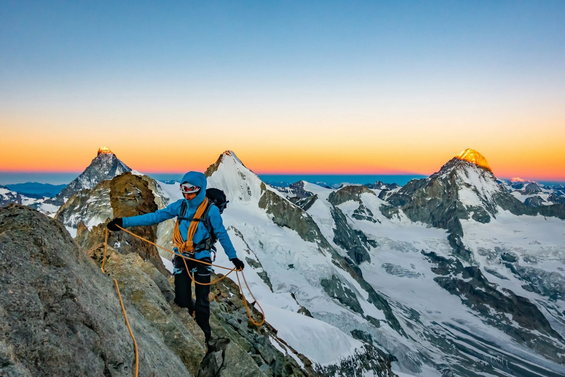 Guided climber on an alpine ridge